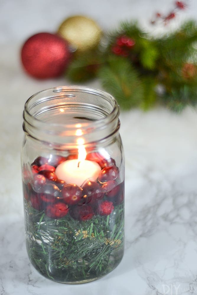 The Christmas candle mason jar holder will add a touch of holiday cheer to any room. 