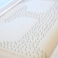 The back of the thumb tack art canvas has a lot of sharp points!