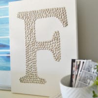 Close up of the DIY thumb tack monogram art.