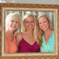 Guests pose in the photo booth at the bridal shower.