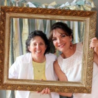 More guests snap pics in the bridal shower photo booth.