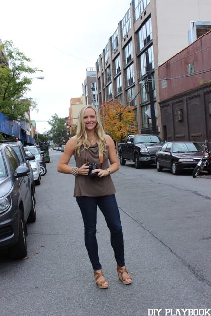 Casey poses with her camera on the streets of NYC.