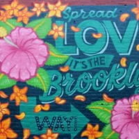 This building wall art in Brooklyn is colorful and cute.
