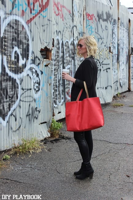 Bridget poses in front of a NYC graffiti wall.