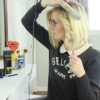 Wrap hair around the barrel of the straightener.