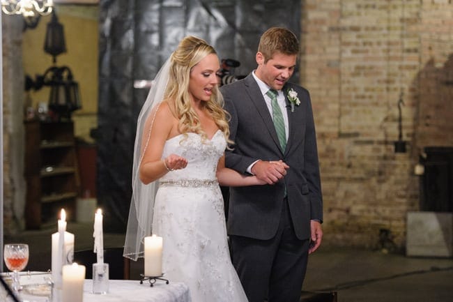 Holding hands with your fiance on your wedding day is a happy time.