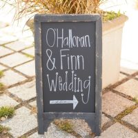 This mini sign directing guests to the wedding is a cute decor addition.