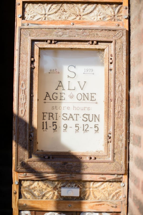 This antique store sign is a rustic and vintage looking.