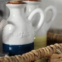 This woven basket is perfect for storing oils and vinegar.