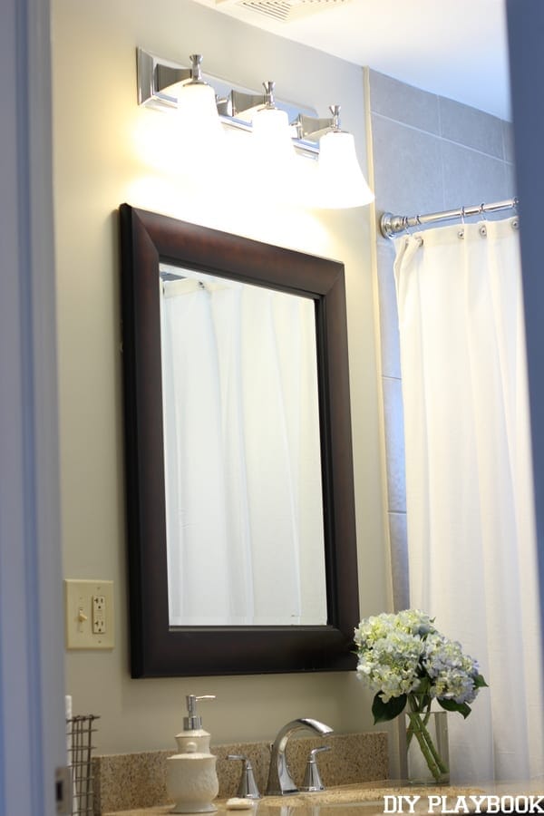 A builder-basic mirror in the bathroom