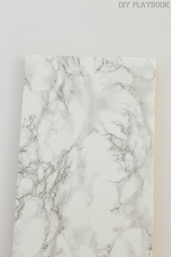 Contact paper affixed to shelf