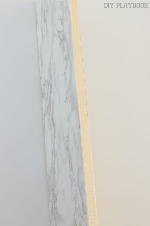 Make sure to cover the edge of the shelf with the contact paper