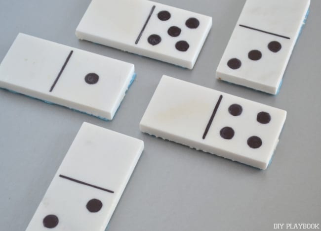 Once domino playing tiles are assembled, lay them out.