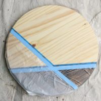 Continue to section out the wood with tape and plastic.