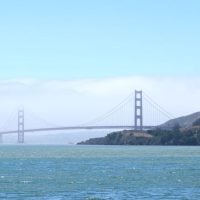 The San Francisco Golden Gate Bridge looks stunning against the water.