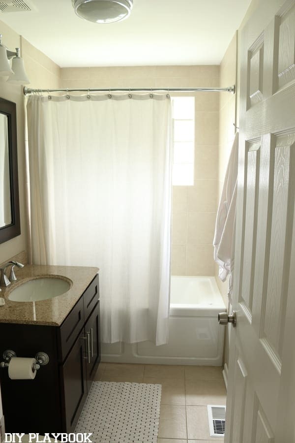 In this photo, my shower curtain is way too short! Doesn't reach the floor and is too far from the ceiling!