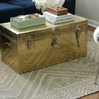 This renovated gold trunk is great for storage.