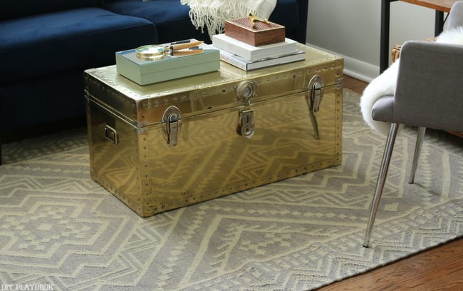 This renovated gold trunk is great for storage.