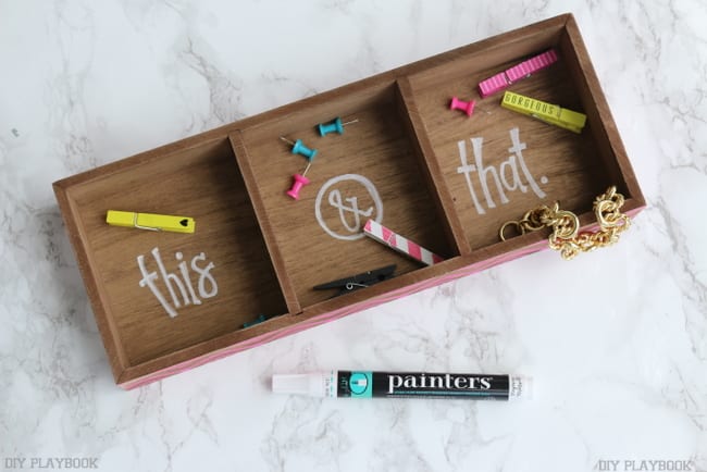 This divided wooden tray is perfect for office supplies like paper clips and push pins