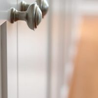 Knob hardware on the built-in bookshelves.