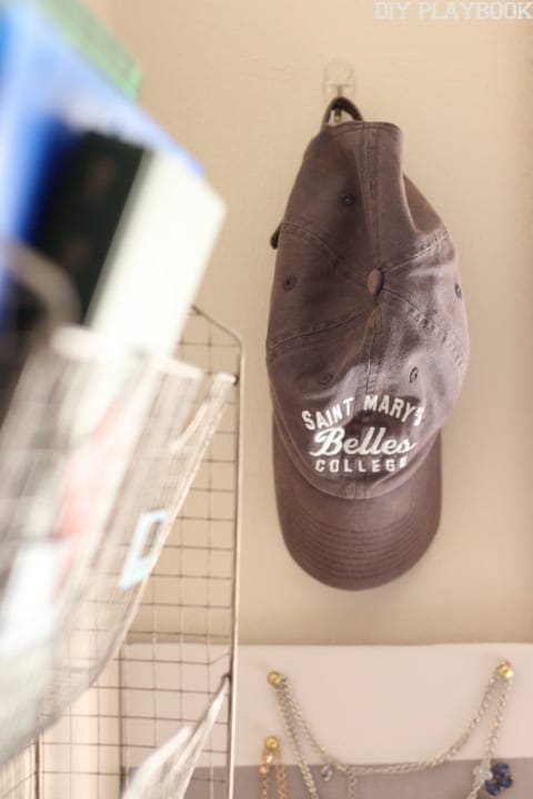 A place to hang hats in a dorm room saves space.