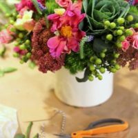 having some fun creating gorgeous flower centerpieces