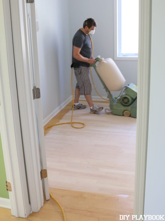 The first step to refinishing the hardwood floors was to have them sanded.
