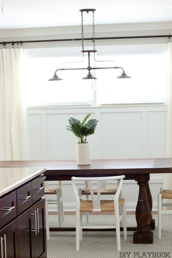 Industrial light fixture above the dining room table. 