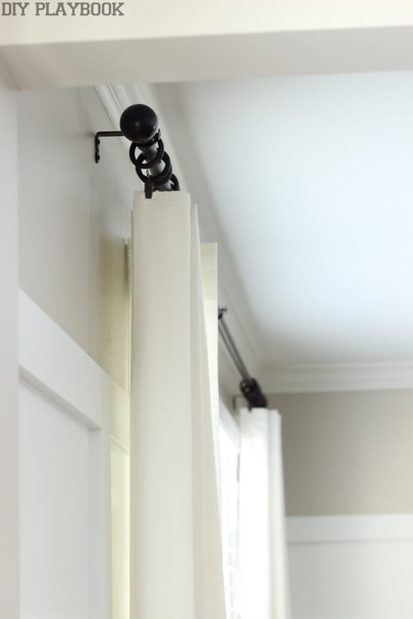 Details of a curtain rod hanging.