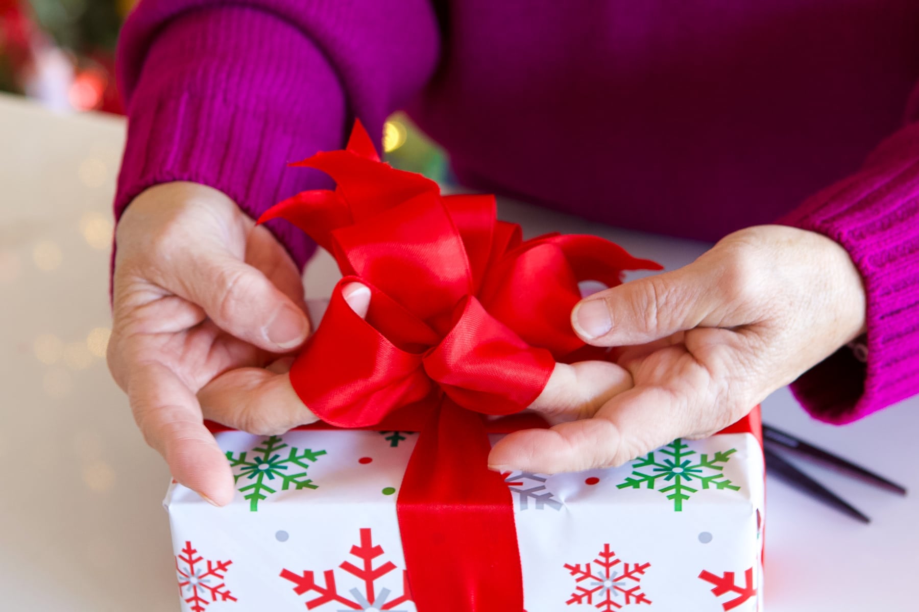 Fluff your ribbon to get it to look nice in your holiday bow