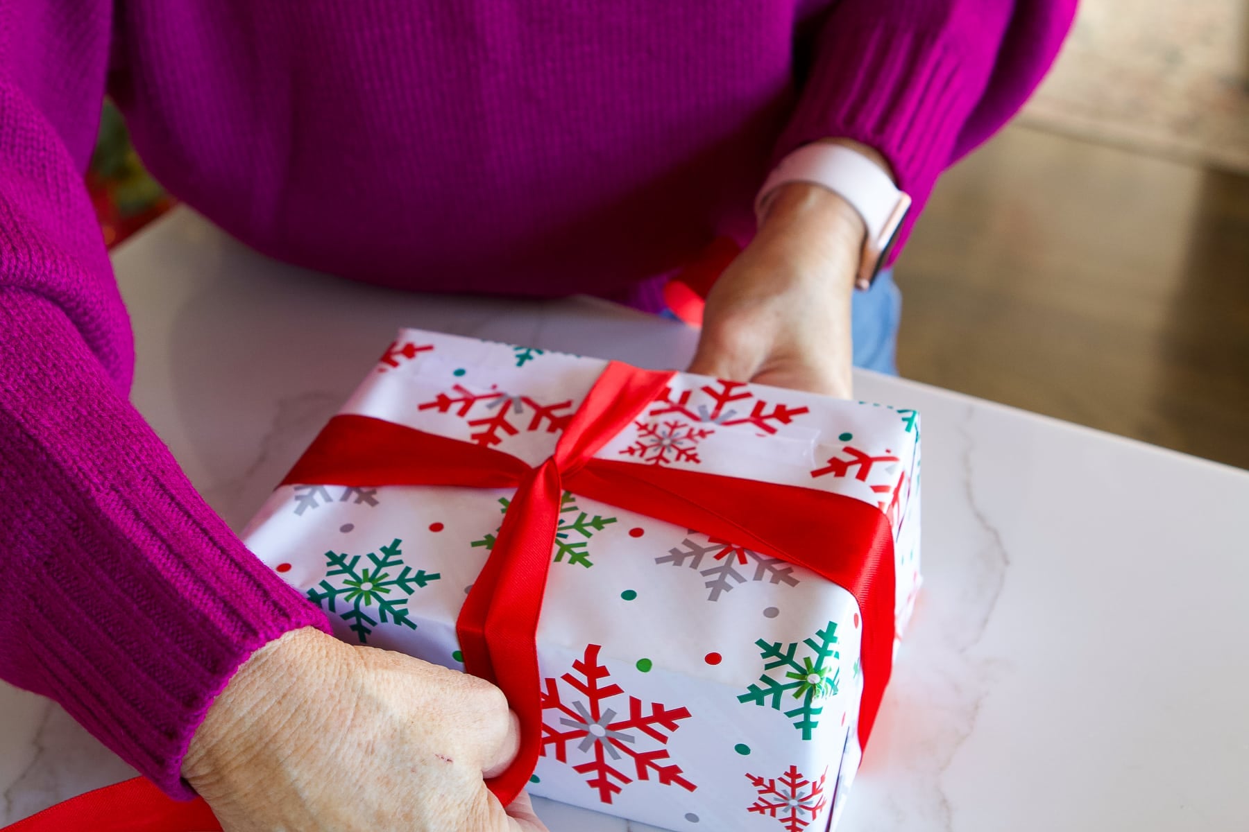 Flip the present over and get the ribbon on it