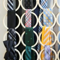 These ties are color coordinated and organized into a new hanger system.