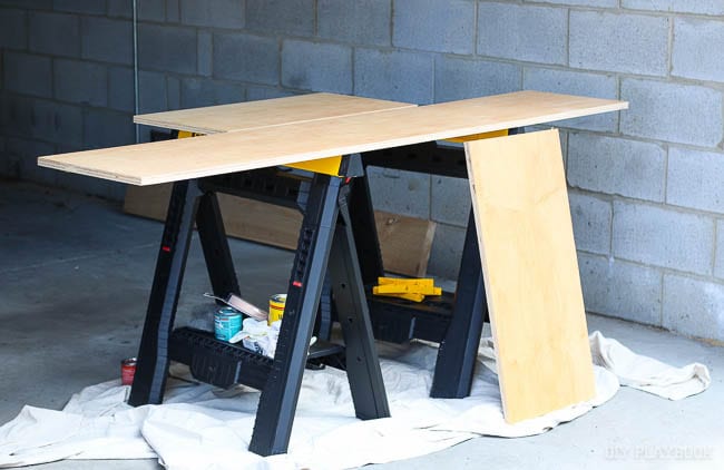 The saw horses and plywood are ready for the next step