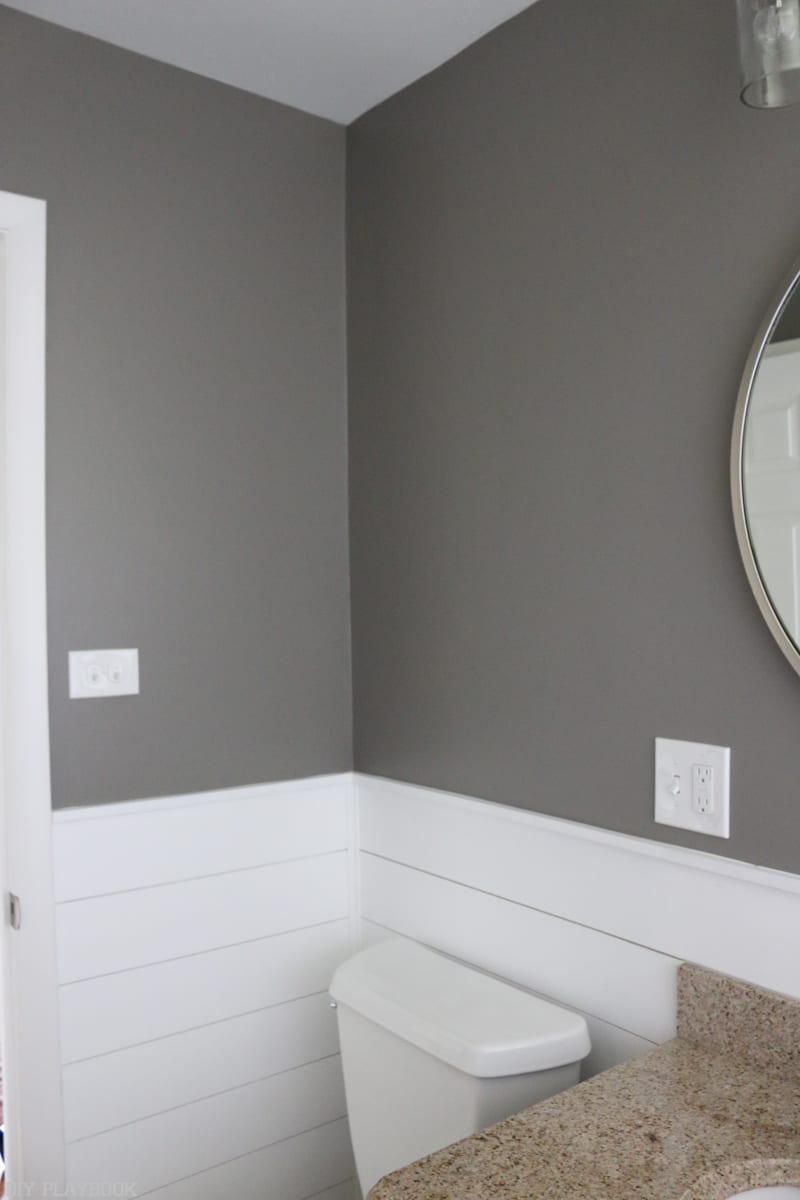 Bathroom with bold paint and shiplap makeover.