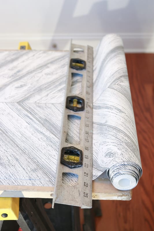 Lay your wallpaper flat before cutting.