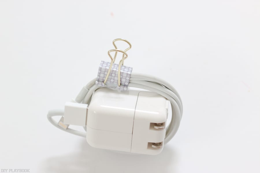 To keep the phone charger organized in the basket, I clip the cord with this binder clip. 