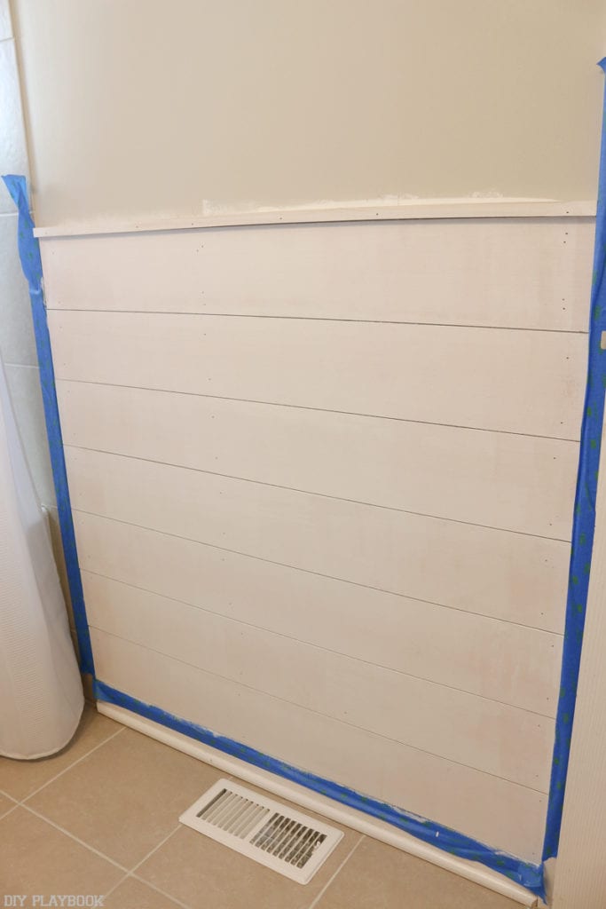 Continue the process until all pieces of shiplap are secured on the wall.