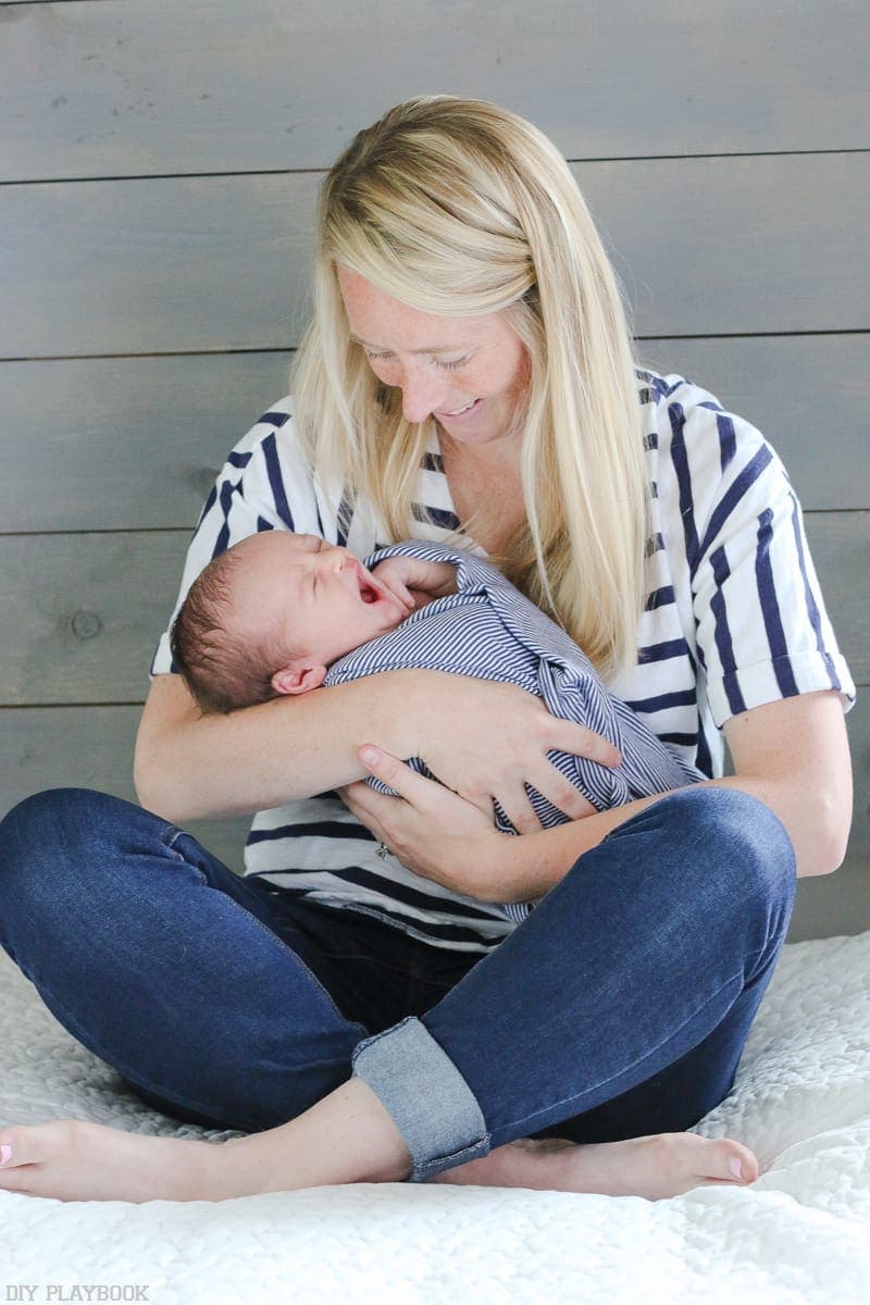 Babies are most comfy with Mom during photo shoots.