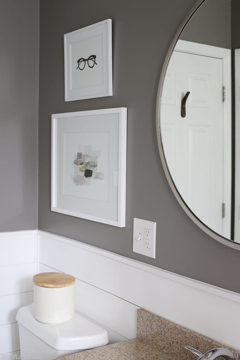 bathroom mirror showing door hook in background