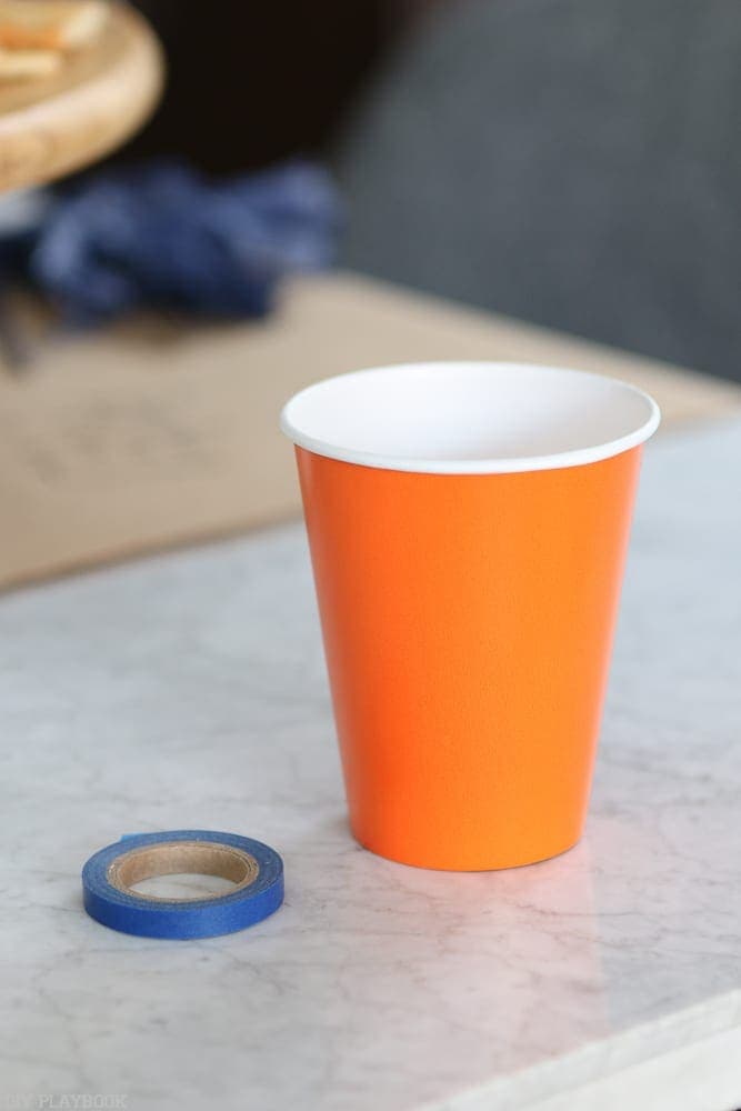 Start with an orange cup and some washi tape.