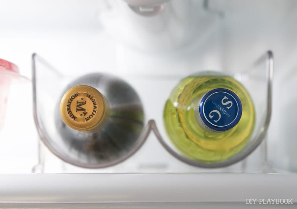 Wine bottle take up less space on this small shelf with the wine holder.