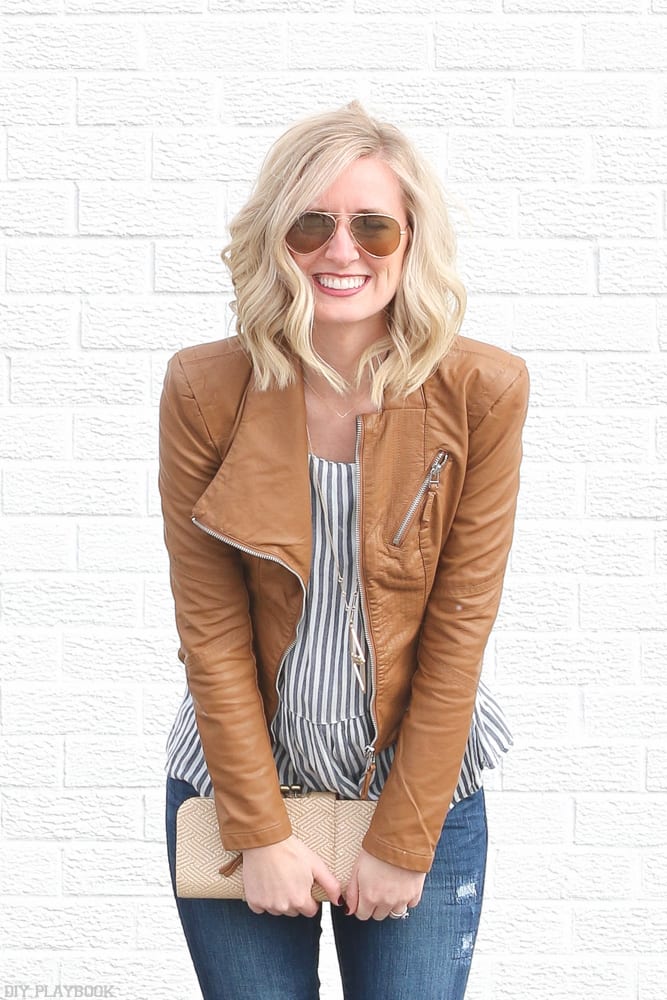 Brown leather jacket and aviator glasses look cute with casual beachy waves.
