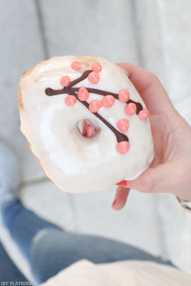 Enjoying a cherry blossom doughnut in Washington, Dc.