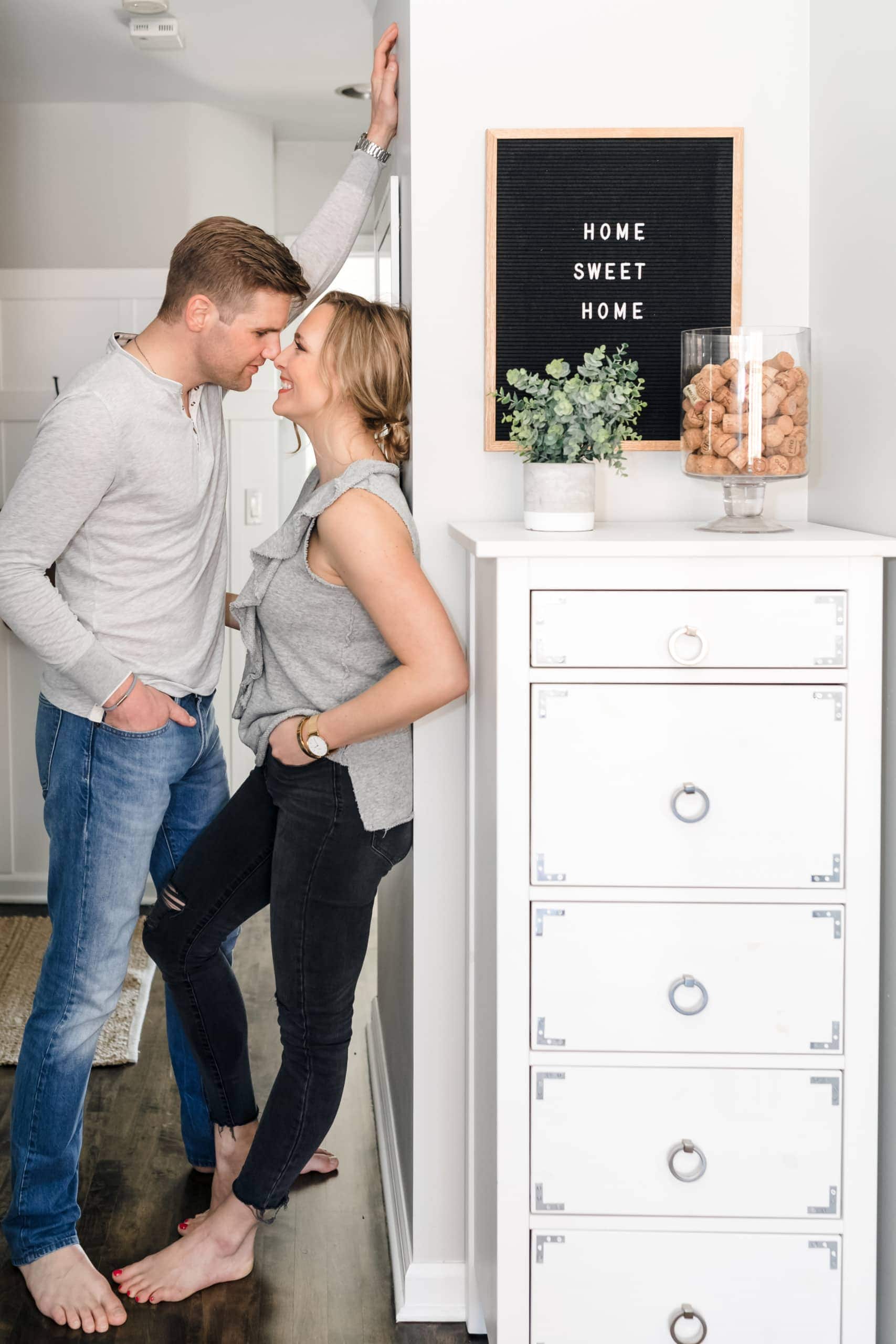 Casey and Finn with home sweet home sign