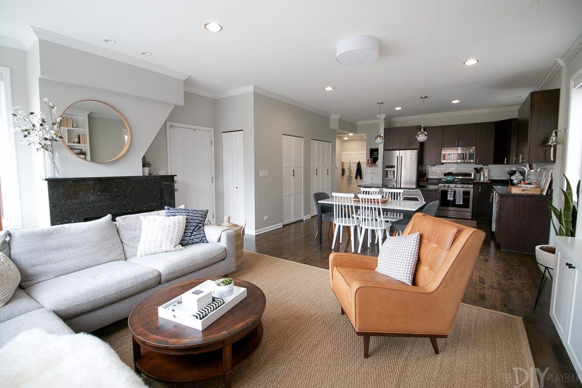 Chicago Condo Home Tour: An "after" shot of our livingroom and kitchen. We love the changes we have made including adding our amazing sectional!