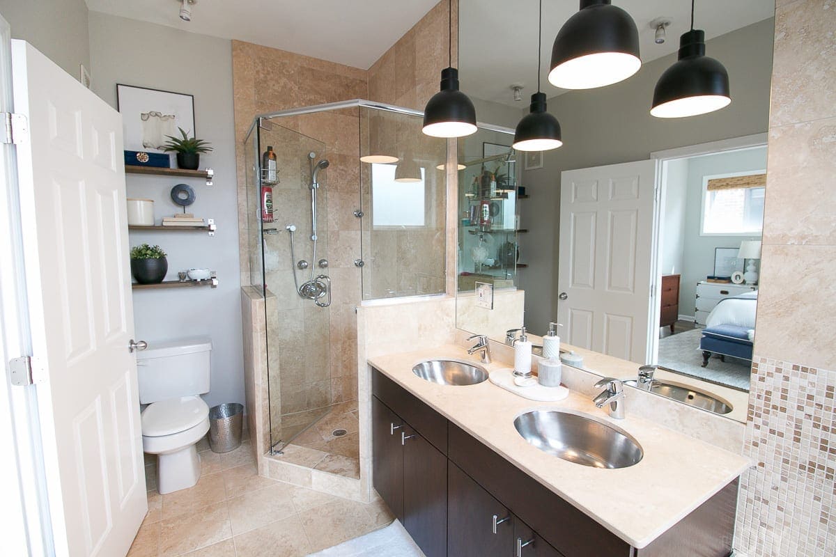 The master bath hasn't changed that much, but we did put in new pendant lights above the sinke and add some shelving above the toilet. Somday I'll change that tile!