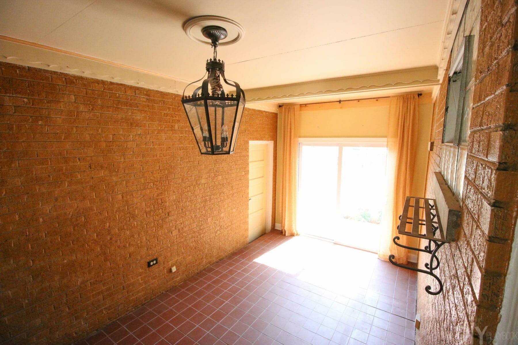 An older shot of the mudroom which shows the doors and how you enter from the garage into the house. 