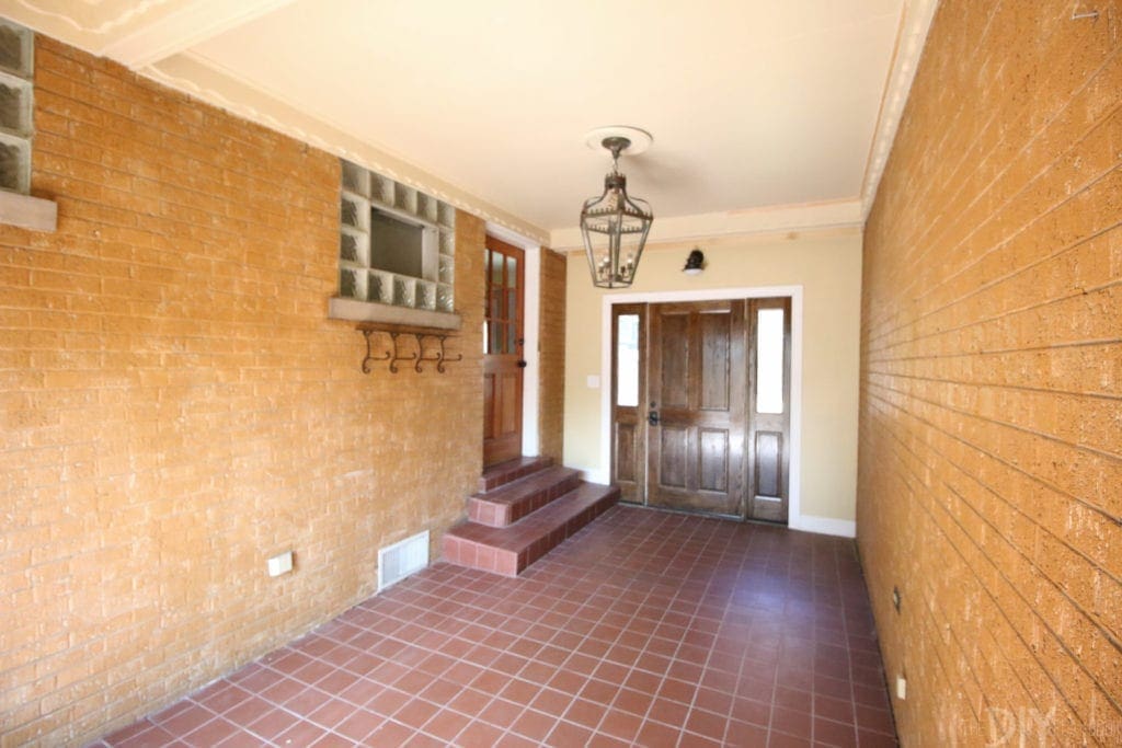 A dark and outdated mudroom space