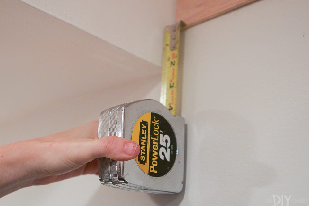 interior designer taking measurements for a new layout