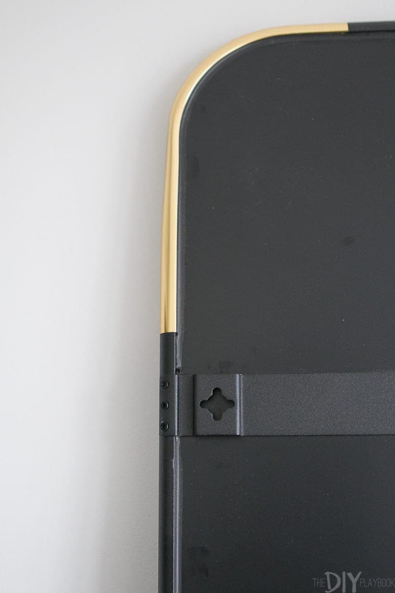 The metal backing of a full-length mirror.